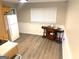 Cozy kitchen area with modern flooring, compact table, and black bar stools at 10178 Top Tree Ct, Jonesboro, GA 30238