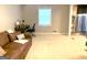 A bright living space merges comfort with functionality, featuring a plush sofa and a desk area, perfect for work or relaxation at 10178 Top Tree Ct, Jonesboro, GA 30238