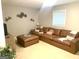 Cozy living room showcasing a large sectional sofa and unique bicycle-themed decor at 10178 Top Tree Ct, Jonesboro, GA 30238