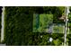Aerial view of the property's layout, showcasing its landscaping, and surrounding greenery at 357 W Hightower Trl, Social Circle, GA 30025