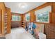 Basement space with wood paneled walls and brick accents at 357 W Hightower Trl, Social Circle, GA 30025