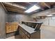 Finished basement area with a sink, bar and concrete floors at 357 W Hightower Trl, Social Circle, GA 30025