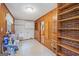 Basement with sink, brick accents, wood paneling and tiled flooring at 357 W Hightower Trl, Social Circle, GA 30025