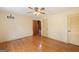 The bedroom has wood floors, neutral paint, and a ceiling fan for comfort and air circulation at 357 W Hightower Trl, Social Circle, GA 30025
