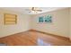 The bedroom features hardwood floors, neutral paint, and a window for natural light and fresh air at 357 W Hightower Trl, Social Circle, GA 30025