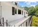 View of home with walkway, contrasting dark shutters and window trim at 357 W Hightower Trl, Social Circle, GA 30025