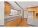 Kitchen with stainless appliances, neutral backsplash and view into living room at 357 W Hightower Trl, Social Circle, GA 30025