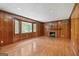 Spacious living room with hardwood floors, fireplace, and a large bay window offering ample natural light at 357 W Hightower Trl, Social Circle, GA 30025