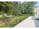 View of a home's side patio and mature magnolia trees at 357 W Hightower Trl, Social Circle, GA 30025