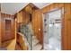 Carpeted staircase with wood-paneled walls leads to an upstairs bathroom and bedrooms in the house at 357 W Hightower Trl, Social Circle, GA 30025