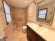 Neutral bathroom with a new vanity, mirror, and a glass-enclosed shower at 601 Clubland Se Cir, Conyers, GA 30094
