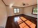 Serene bedroom with hardwood floors, plenty of natural light, and a ceiling fan at 601 Clubland Se Cir, Conyers, GA 30094