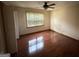 Comfortable bedroom with hardwood floors and a large window offering natural light at 601 Clubland Se Cir, Conyers, GA 30094