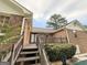 Exterior of the brick home with a wooden deck at 601 Clubland Se Cir, Conyers, GA 30094