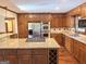Gourmet kitchen featuring stainless steel appliances, custom cabinetry, and a large island with granite countertops at 601 Clubland Se Cir, Conyers, GA 30094