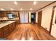 Bright eat-in kitchen featuring hardwood floors, granite countertops, stainless appliances and pendant lighting at 601 Clubland Se Cir, Conyers, GA 30094