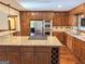 Gourmet kitchen featuring stainless steel appliances, custom cabinetry, and a large island with granite countertops at 601 Clubland Se Cir, Conyers, GA 30094