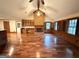 Bright living room with vaulted ceilings, hardwood floors, fireplace, and large windows filling the space with natural light at 601 Clubland Se Cir, Conyers, GA 30094