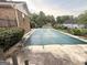 The pool is covered for the winter with a full cover on the concrete deck at 601 Clubland Se Cir, Conyers, GA 30094