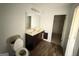 Bathroom featuring a single sink vanity with a large mirror, and a toilet at 1650 Larkspur Trl, Conyers, GA 30012