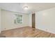 Comfortable bedroom features a window and laminate wood flooring at 340 Loblolly Rdg, Locust Grove, GA 30248