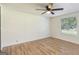 Bright bedroom features a window and laminate wood flooring at 340 Loblolly Rdg, Locust Grove, GA 30248