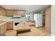 Functional kitchen features white appliances, wooden cabinets, and an island at 340 Loblolly Rdg, Locust Grove, GA 30248