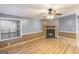 Cozy living room features a fireplace and laminate wood flooring at 340 Loblolly Rdg, Locust Grove, GA 30248