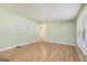 Open layout with wood-look flooring and soft green walls, offering a spacious and comfortable atmosphere at 340 Loblolly Rdg, Locust Grove, GA 30248