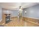Spacious living room offers a fireplace and seamless wood laminate flooring at 340 Loblolly Rdg, Locust Grove, GA 30248
