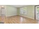 Bright living room features wood-look floors and a window for natural light at 340 Loblolly Rdg, Locust Grove, GA 30248