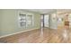 A light-filled living room featuring wood-look flooring and neutral walls, creating an inviting and serene atmosphere at 340 Loblolly Rdg, Locust Grove, GA 30248