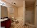 This bathroom features a shower and tub with a large vanity and window at 955 Foxworthy Ln, Riverdale, GA 30296