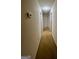 A long hallway features many doors and a thermostat at 955 Foxworthy Ln, Riverdale, GA 30296
