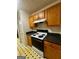 This kitchen is equipped with new appliances and wooden cabinets at 955 Foxworthy Ln, Riverdale, GA 30296