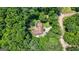 A private home surrounded by lush greenery and mature trees offers seclusion from the road at 207 Conkle Rd, Hampton, GA 30228
