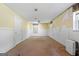 Unfinished basement with painted walls and door leading to additional space at 207 Conkle Rd, Hampton, GA 30228