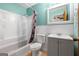 Bathroom with a shower and tub combo, modern sink and vanity, and a stylish frameless mirror at 207 Conkle Rd, Hampton, GA 30228