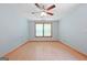 Bedroom with hardwood floors, natural light from large window, and neutral walls at 207 Conkle Rd, Hampton, GA 30228