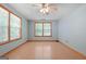 Bright bedroom with wood-look flooring and large windows at 207 Conkle Rd, Hampton, GA 30228