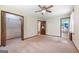 Bright bedroom featuring a ceiling fan and two closets, offering ample storage space at 207 Conkle Rd, Hampton, GA 30228