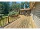 Spacious wooden deck with railing, ideal for outdoor seating and relaxation at 207 Conkle Rd, Hampton, GA 30228
