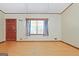 A open living room with wood floors at 207 Conkle Rd, Hampton, GA 30228