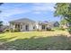 Well-maintained backyard featuring a manicured lawn and a home with white siding at 286 Prominent Loop, Mcdonough, GA 30253