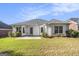 Well-maintained backyard featuring a manicured lawn and a home with white siding at 286 Prominent Loop, Mcdonough, GA 30253