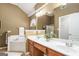 Well-lit bathroom features double sinks, soaking tub, vanity, and a walk-in shower at 286 Prominent Loop, Mcdonough, GA 30253