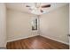 Bedroom with wood-look flooring, ceiling fan, window with blinds, and neutral paint at 286 Prominent Loop, Mcdonough, GA 30253
