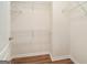 Walk-in closet with white wire shelving and laminate flooring at 286 Prominent Loop, Mcdonough, GA 30253