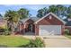 Charming brick home with a well-manicured lawn and an attached two-car garage at 286 Prominent Loop, Mcdonough, GA 30253