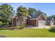 Attractive brick home with well-kept lawn and palm tree, featuring a two-car garage at 286 Prominent Loop, Mcdonough, GA 30253